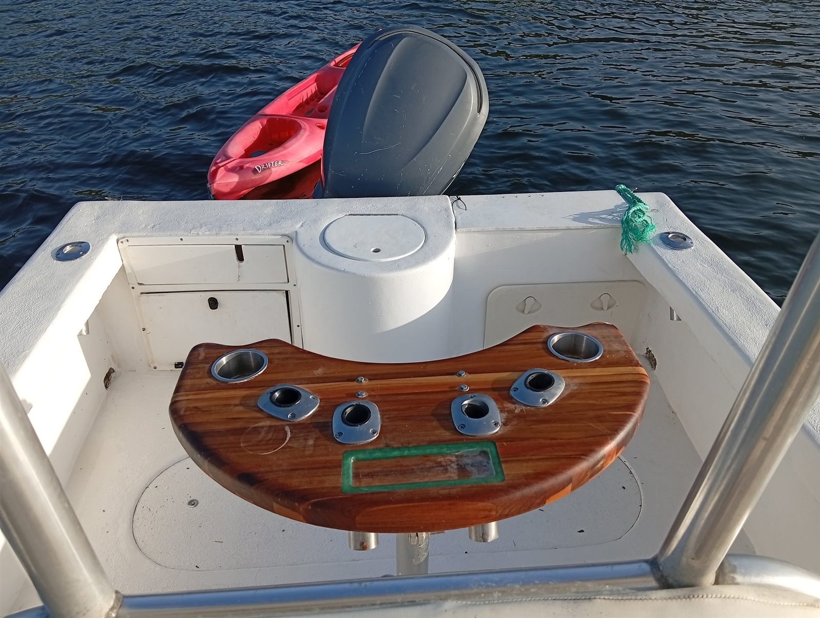 Los Cielos teak bait table with tuna tubes and rod holders at the stern